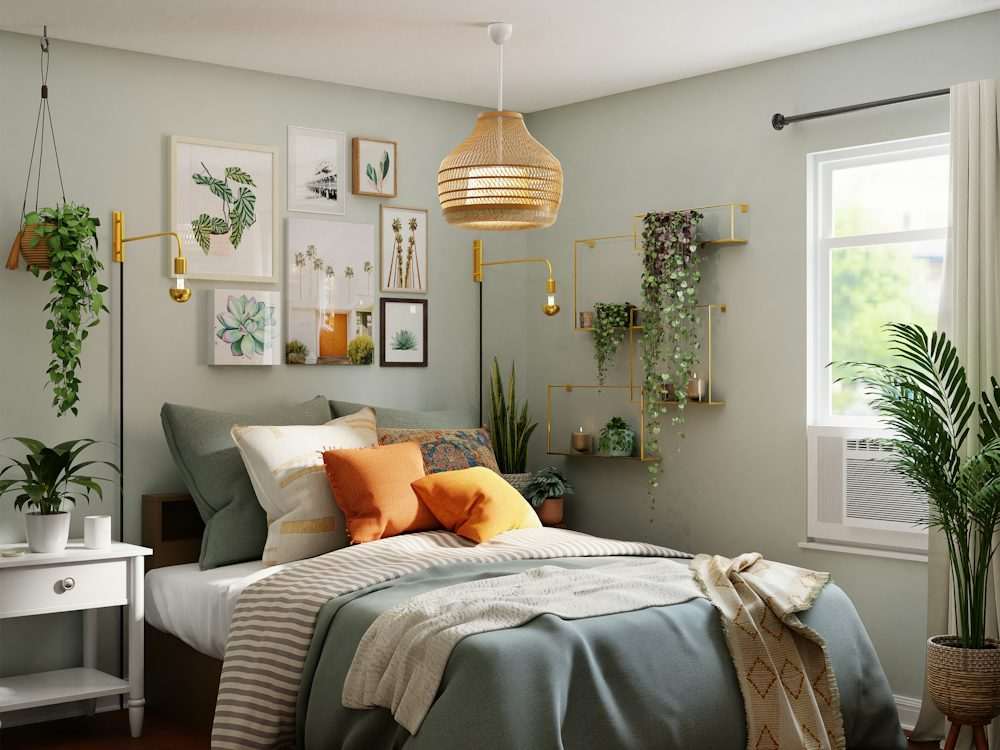 A made bed with plants and framed prints in a calm bedroom