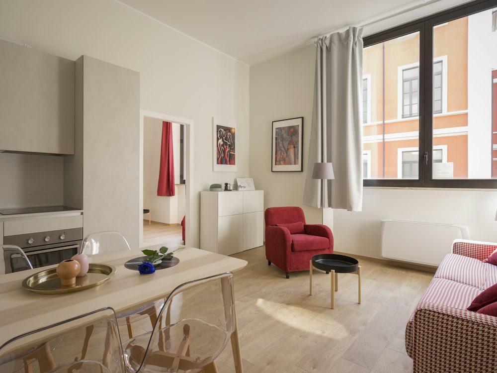 A small studio apartment with a kitchen and living area
