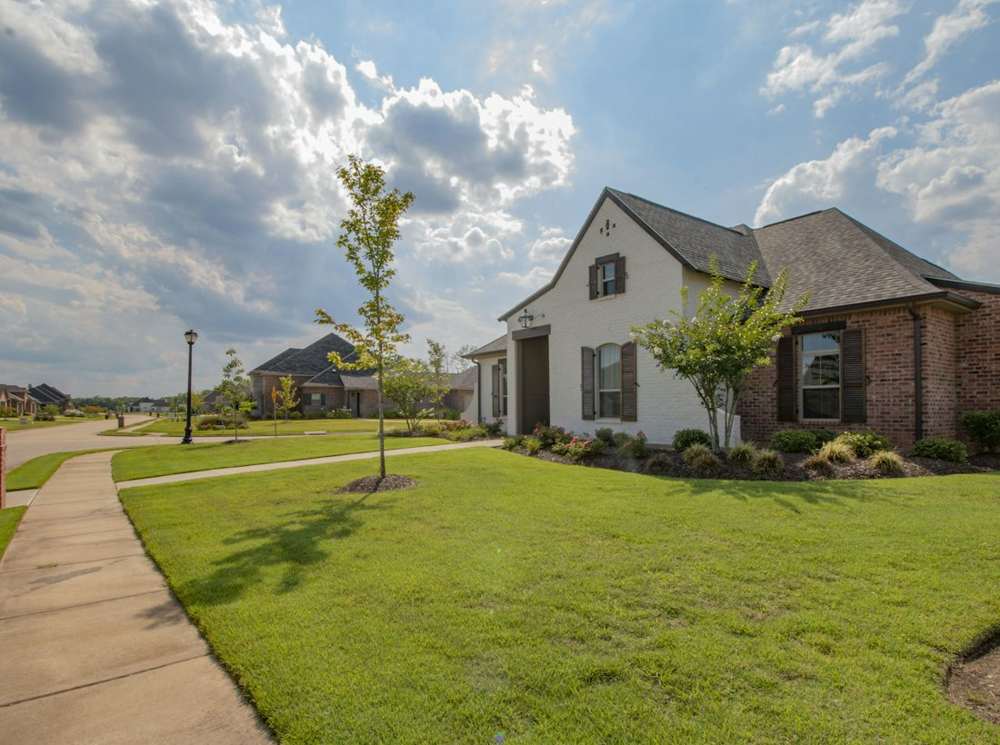 A brick family home on a quiet Texas street